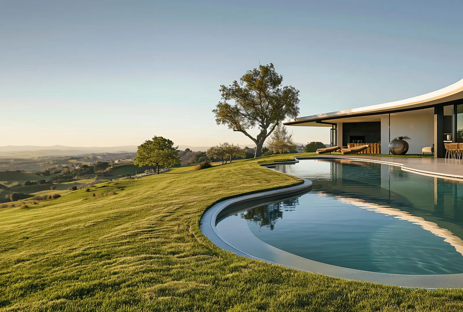 Moorpark modern residence with a curved pool set into a hillside lawn