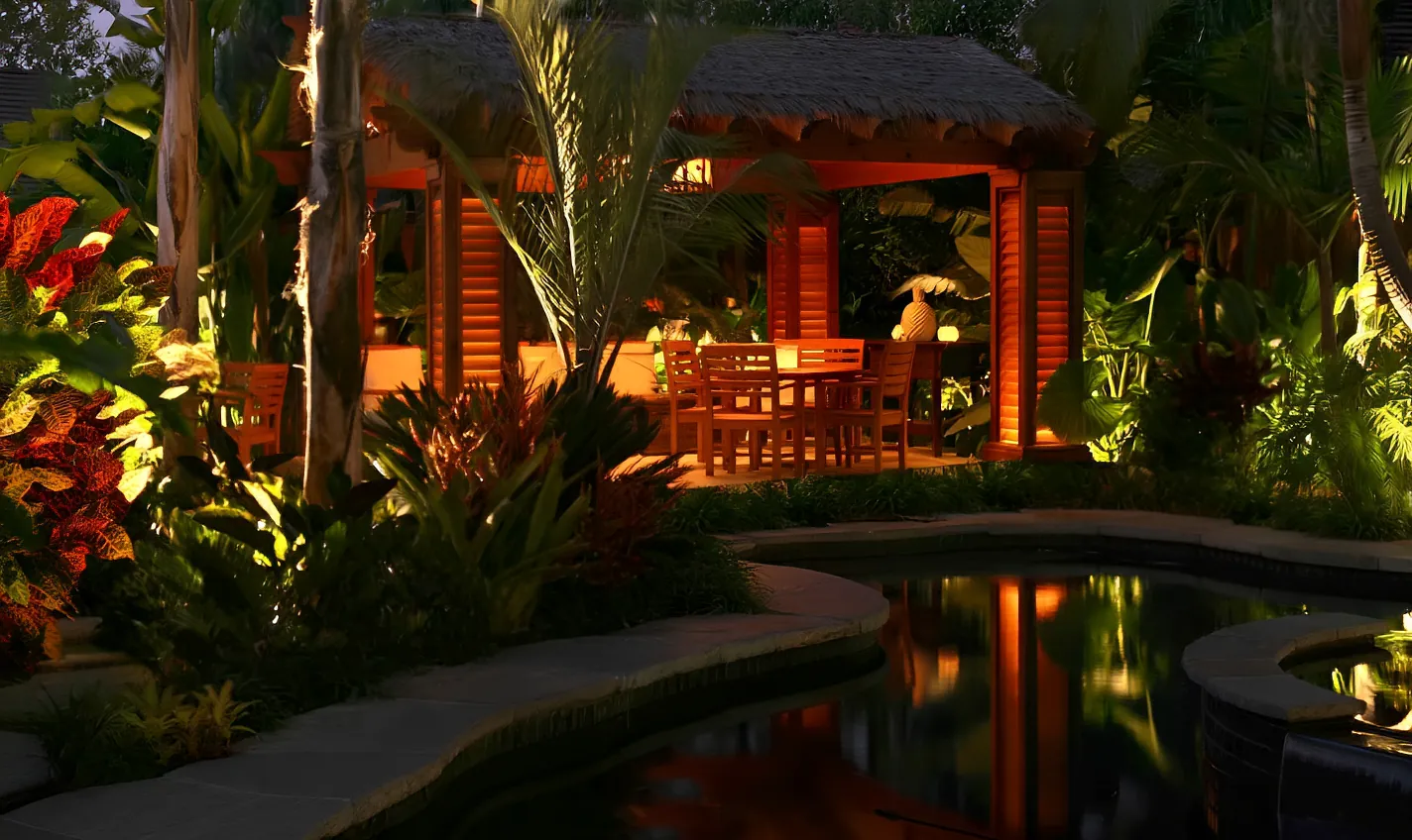 Hawaiian thatch and redwood pergola above a tropical pool and spa in Orange County, lit at dusk