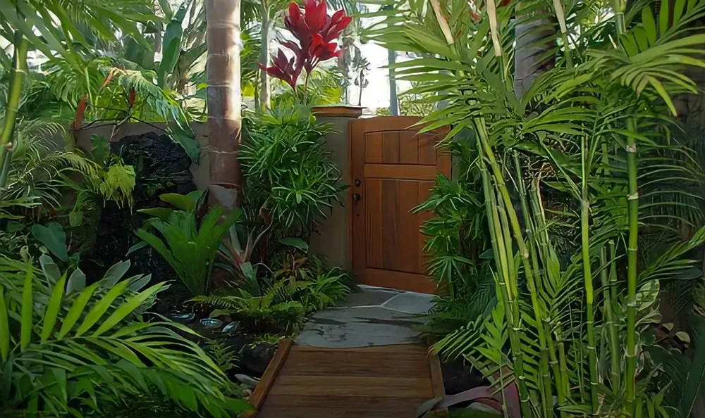 Sunset Magazine feature garden: redwood gate and stone path through tropical planting